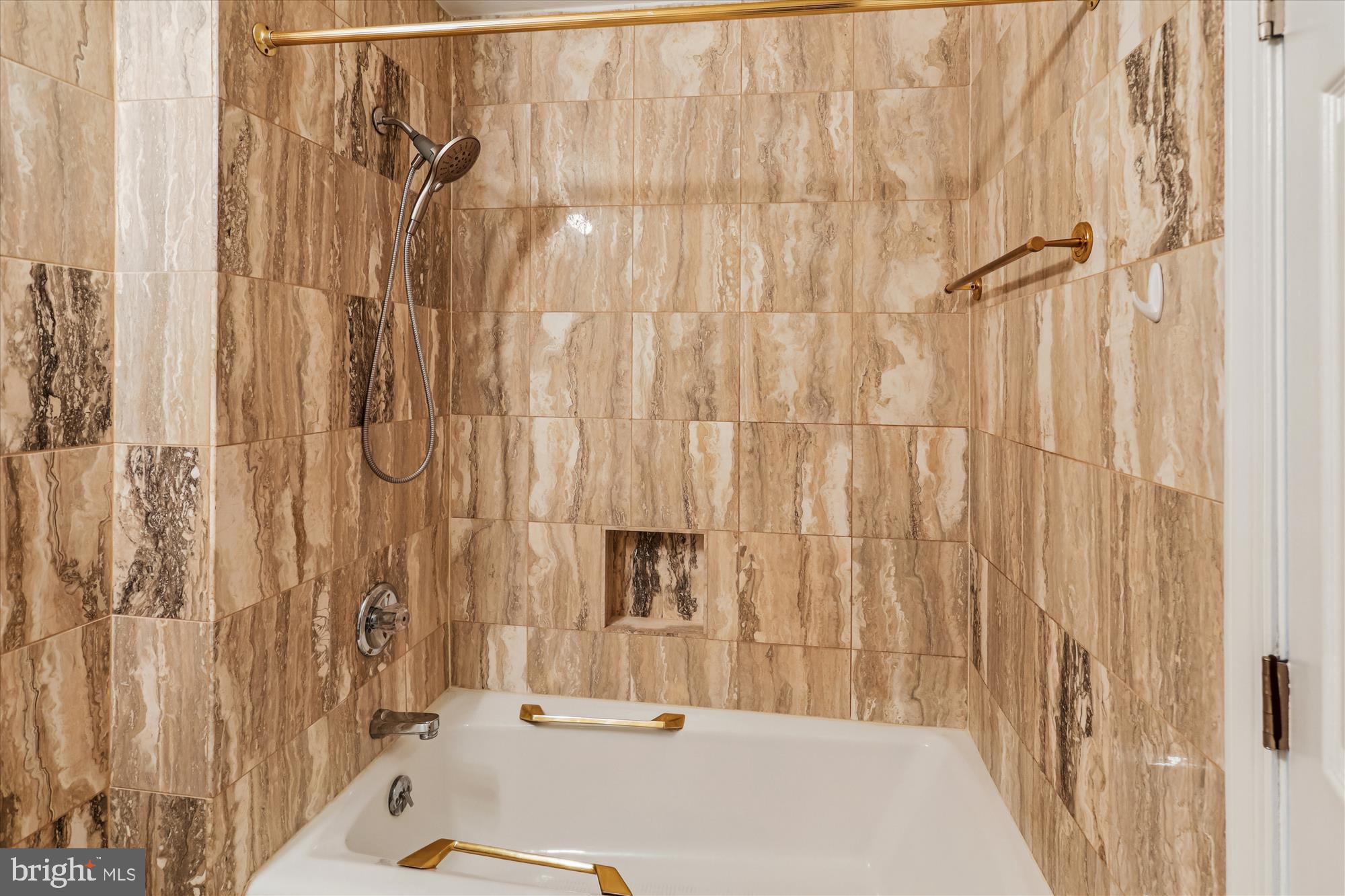 3801 Canterbury Road, Unit 404 Baltimore, MD 21218 - Photo 19 of 37 a bathroom with a tub and shower curtain
