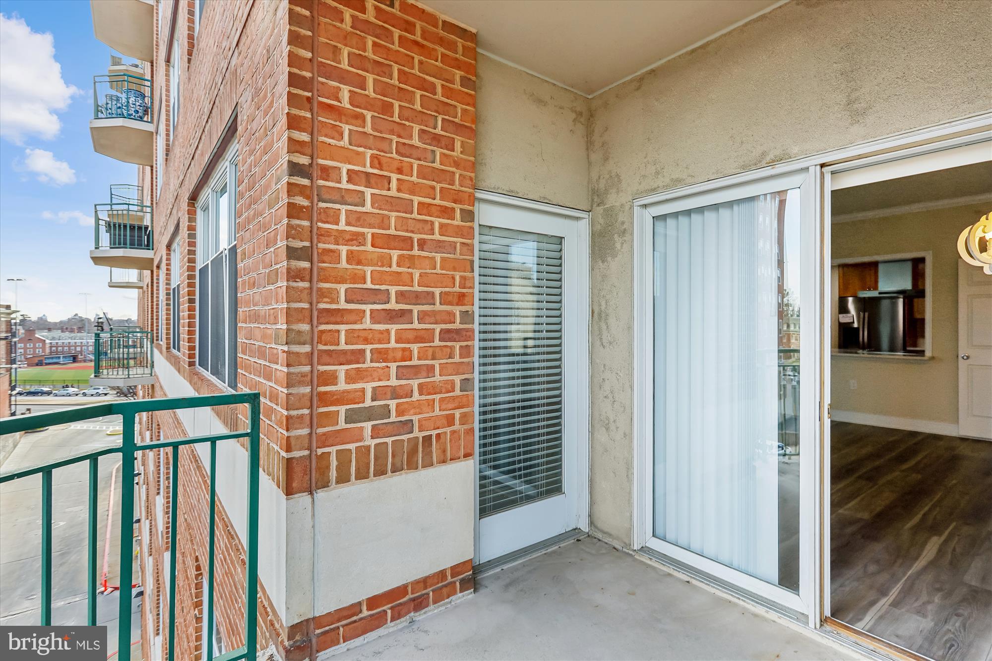 3801 Canterbury Road, Unit 404 Baltimore, MD 21218 - Photo 21 of 37 a view of a balcony with a door