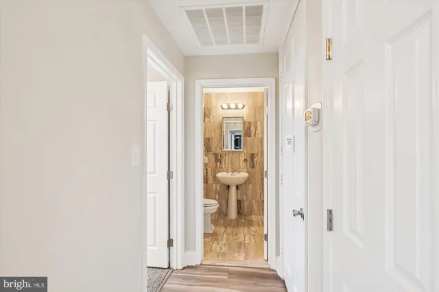 a view of a bathroom from a hallway