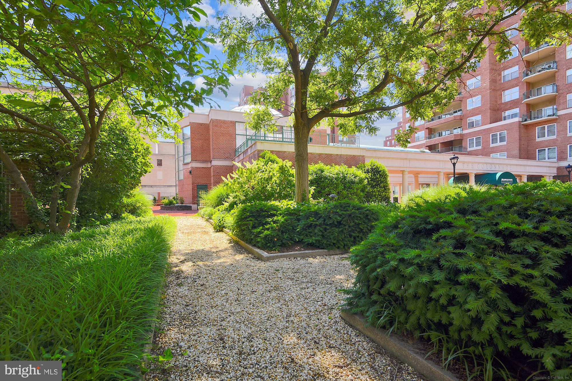 3801 Canterbury Road, Unit 404 Baltimore, MD 21218 - Photo 32 of 37 a view of a building with a yard