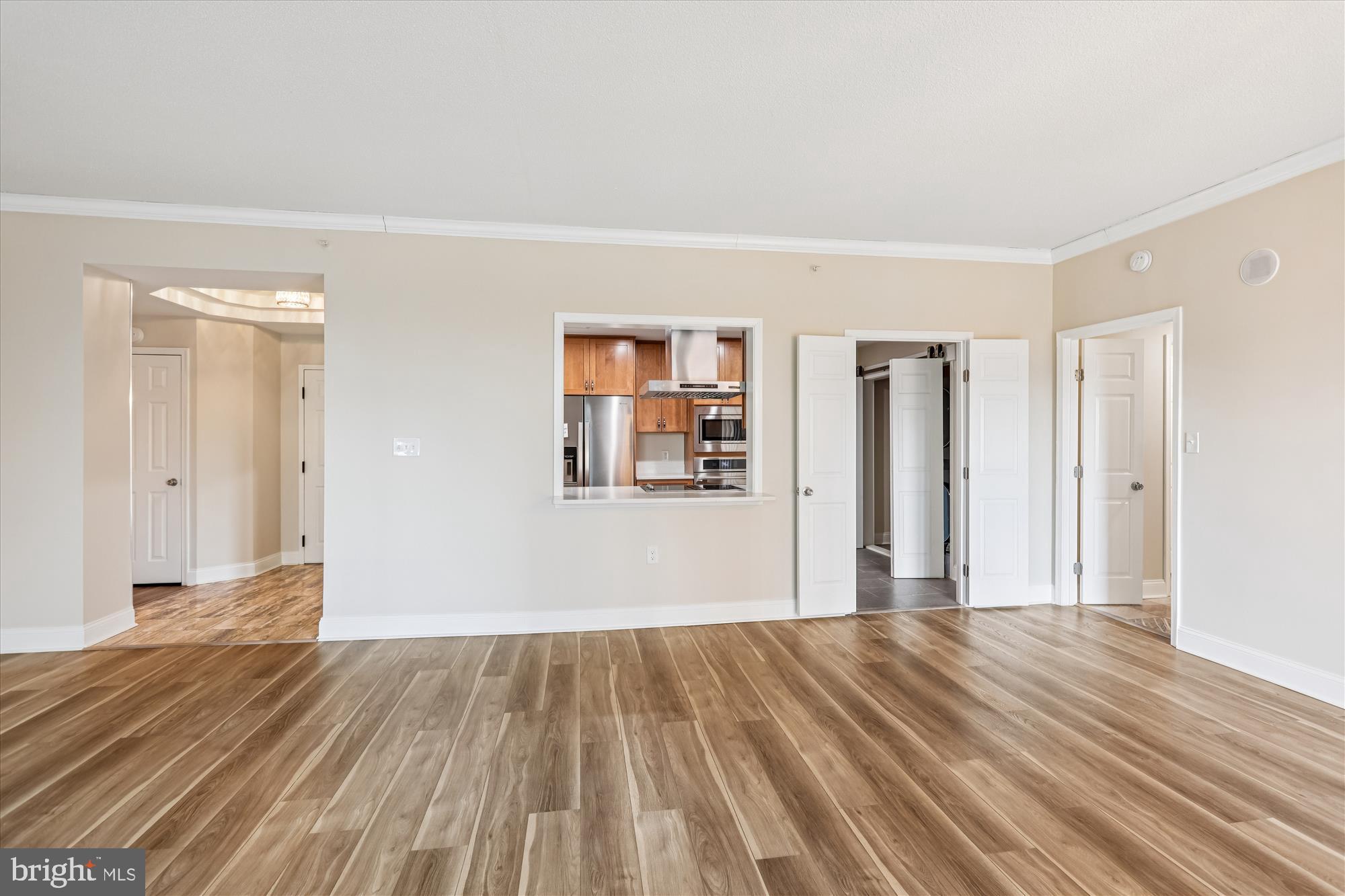 3801 Canterbury Road, Unit 404 Baltimore, MD 21218 - Photo 7 of 37 a view of a room with wooden floor and a window