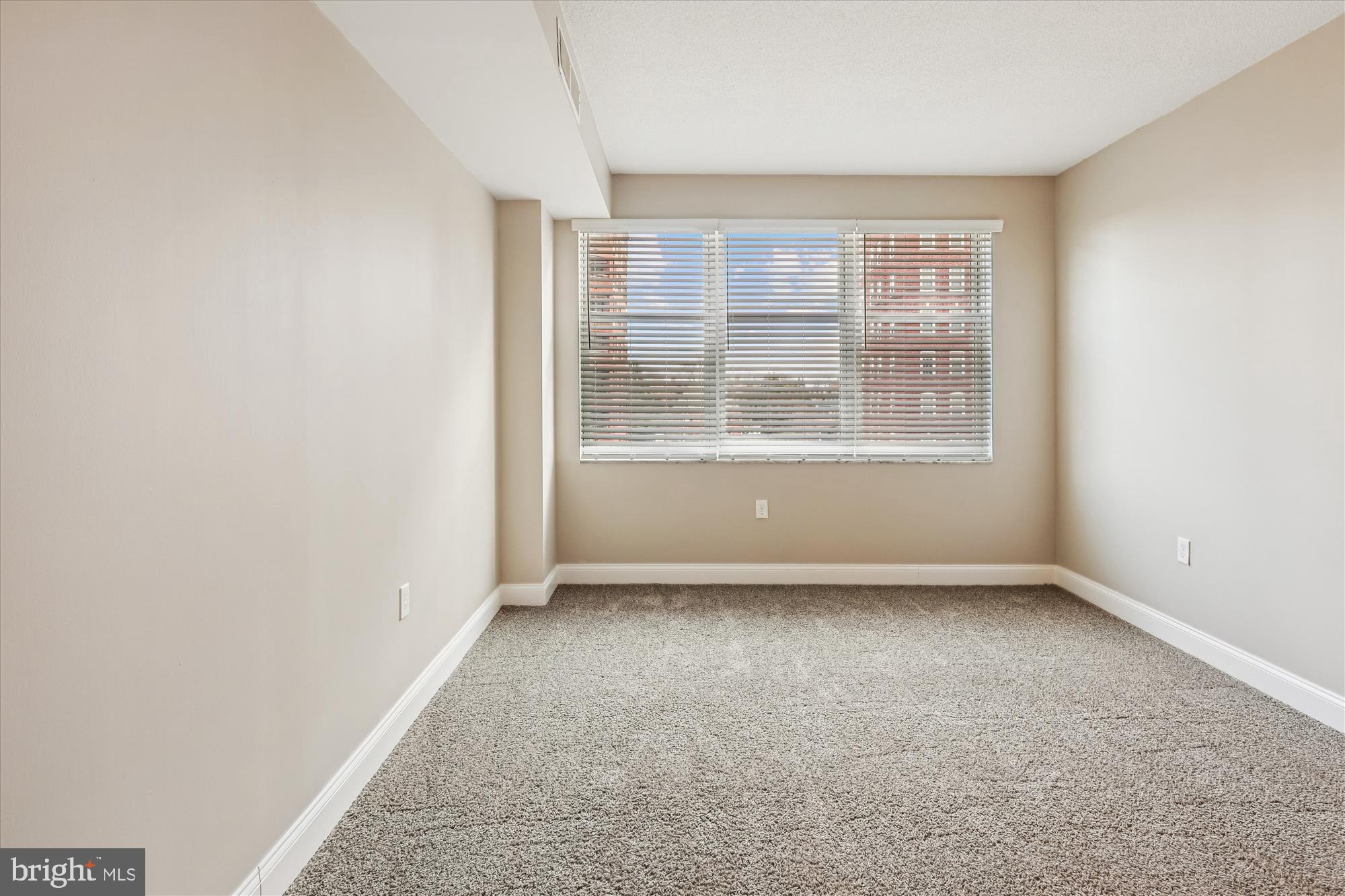 3801 Canterbury Road, Unit 404 Baltimore, MD 21218 - Photo 9 of 37 an empty room with a window