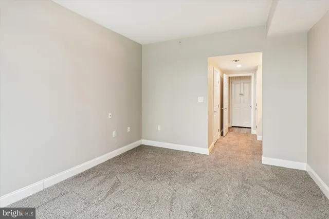 a view of an empty room and a window