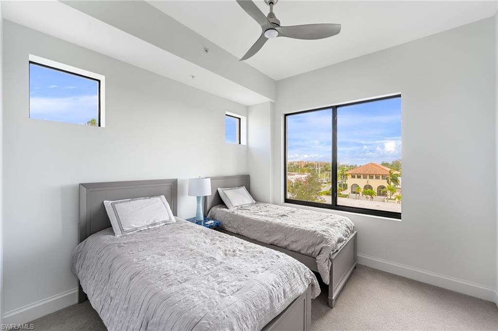 1111 Central, Unit 417S Naples, FL 34104 - Photo 15 of 25 a bedroom with a bed and a window