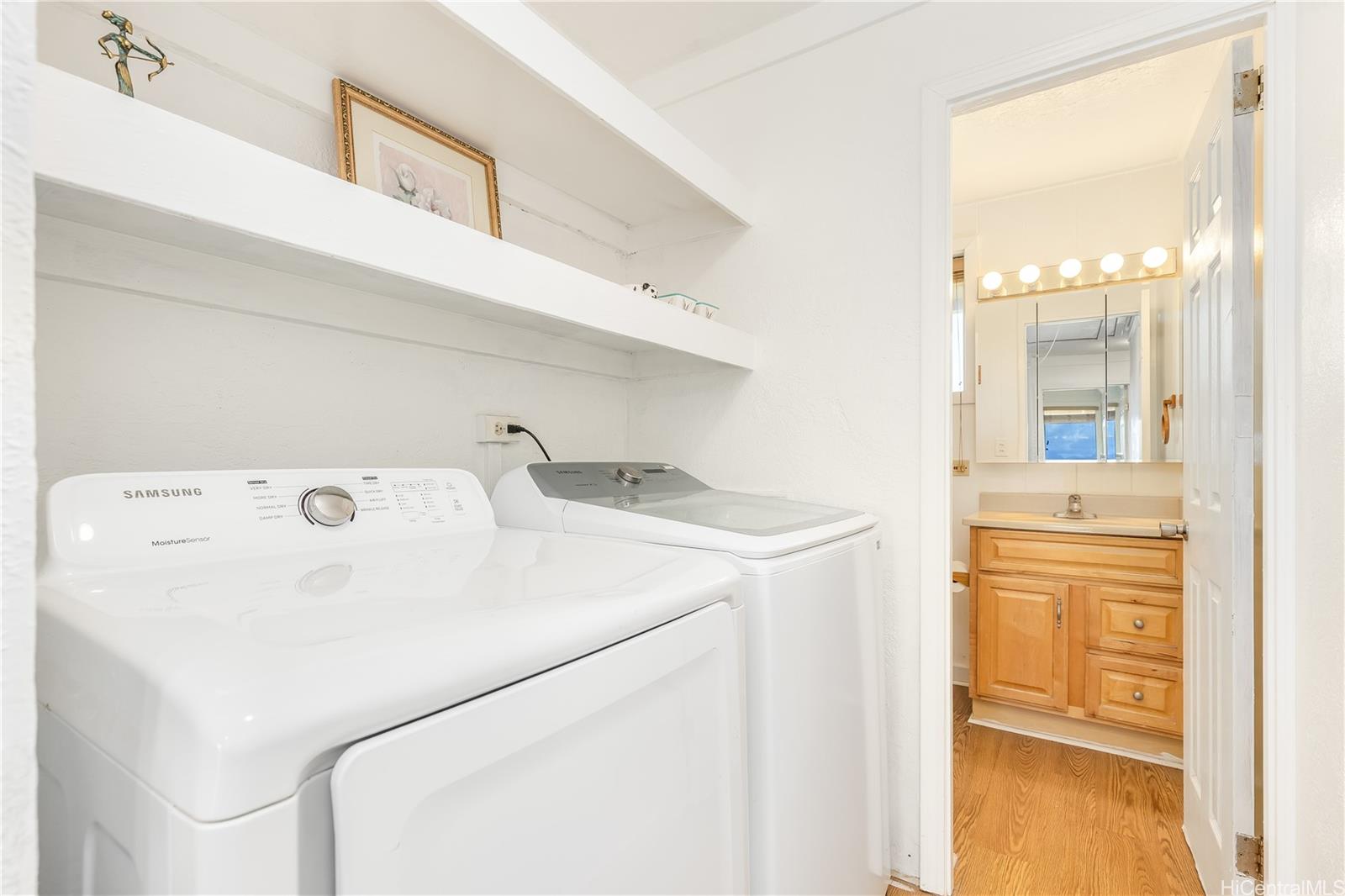 92-787 Makakilo Drive, Unit D28 Kapolei, HI 96707 - Photo 12 of 23 a utility room with dryer and washer