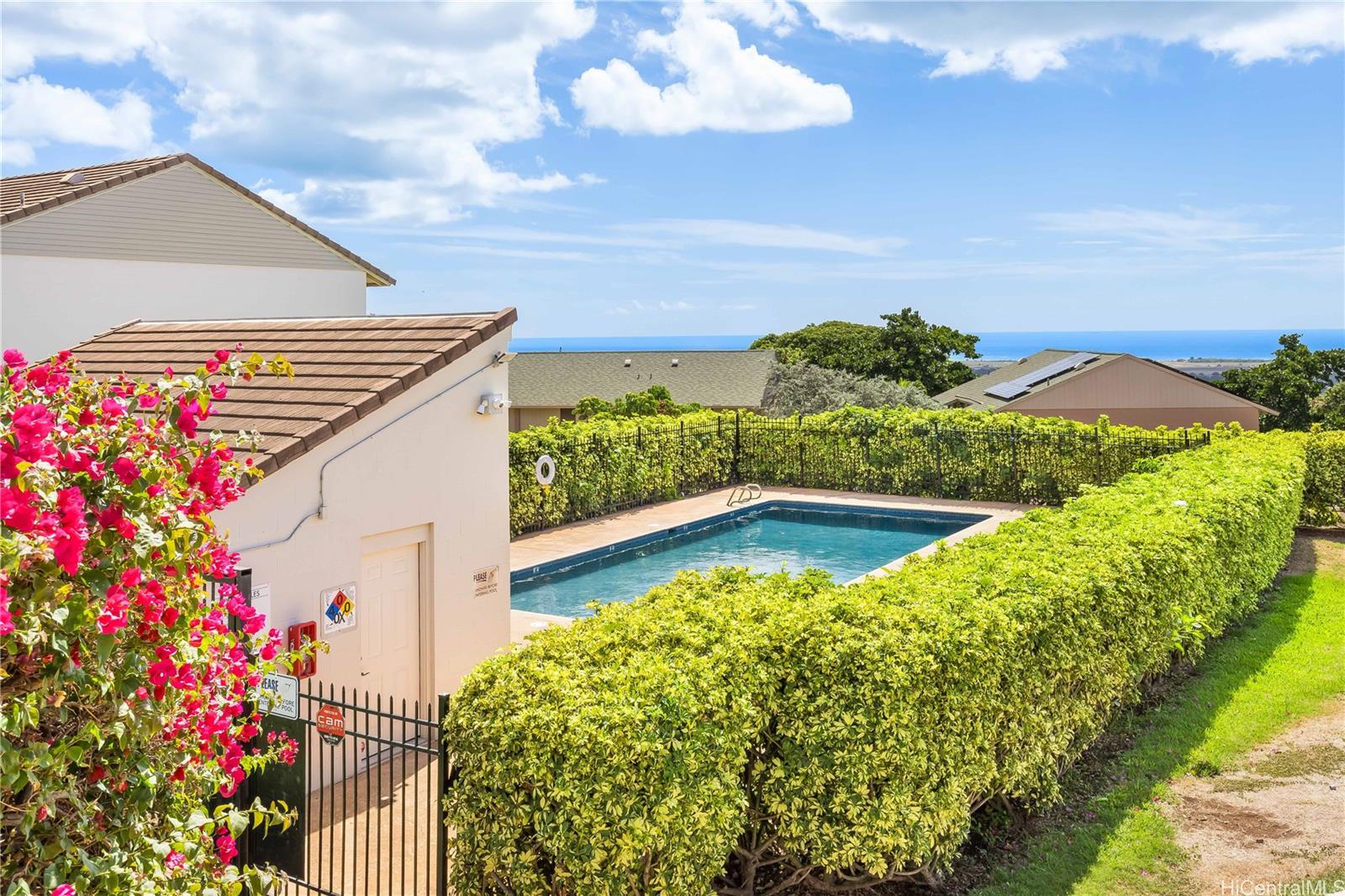 92-787 Makakilo Drive, Unit D28 Kapolei, HI 96707 - Photo 19 of 23 a view of a house with a yard and potted plants