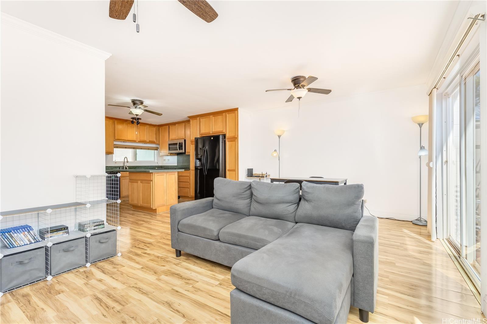 92-787 Makakilo Drive, Unit D28 Kapolei, HI 96707 - Photo 4 of 23 a living room with furniture and a fireplace