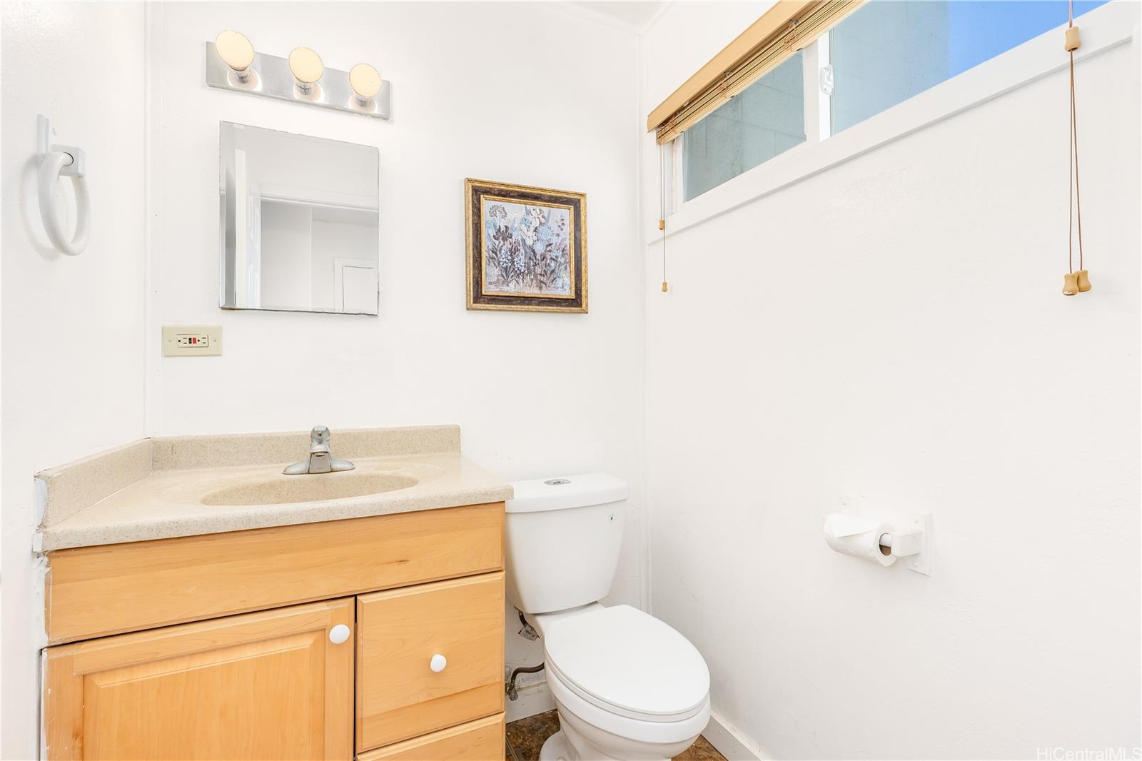 92-787 Makakilo Drive, Unit D28 Kapolei, HI 96707 - Photo 7 of 23 a bathroom with a granite countertop toilet sink and mirror