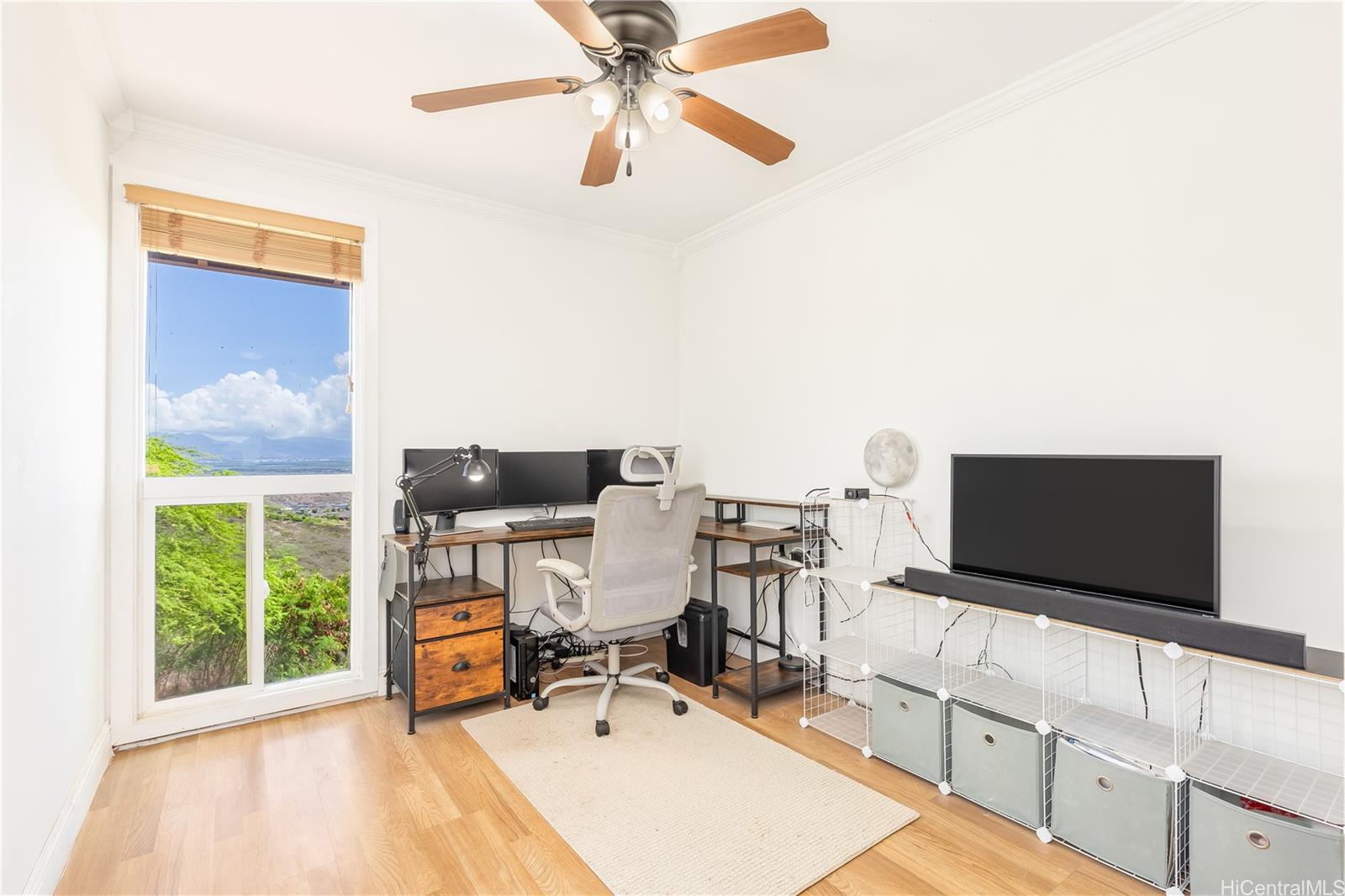 92-787 Makakilo Drive, Unit D28 Kapolei, HI 96707 - Photo 8 of 23 a living room with furniture and a flat screen tv