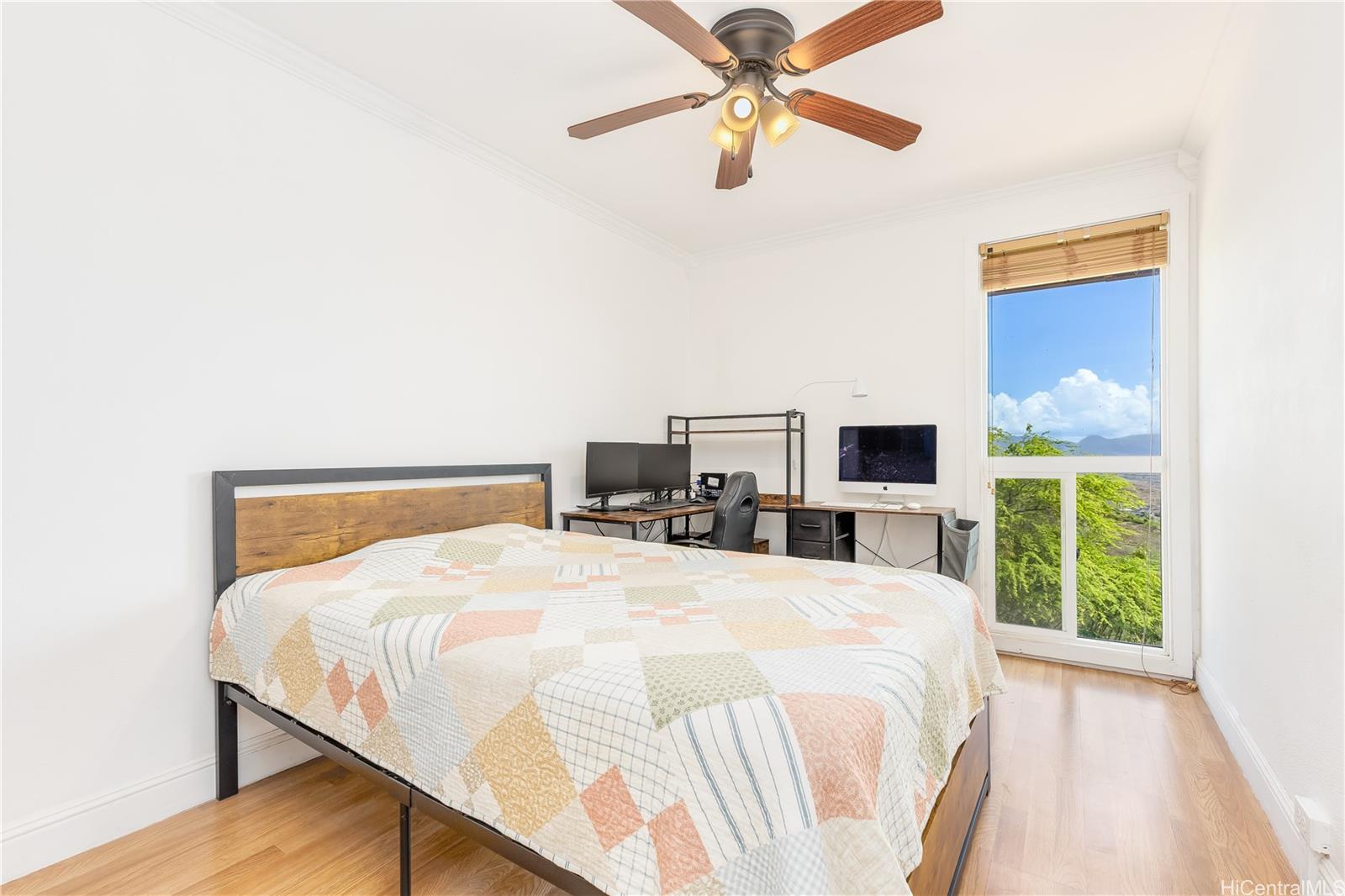 92-787 Makakilo Drive, Unit D28 Kapolei, HI 96707 - Photo 9 of 23 a bedroom with a bed and a large window