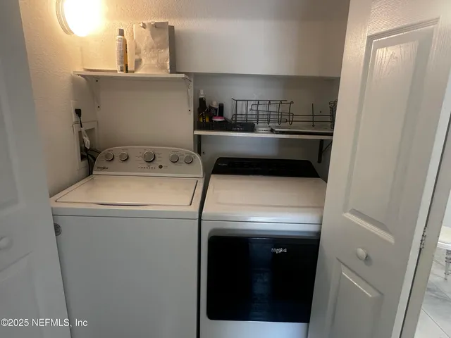 a utility room with dryer and washer