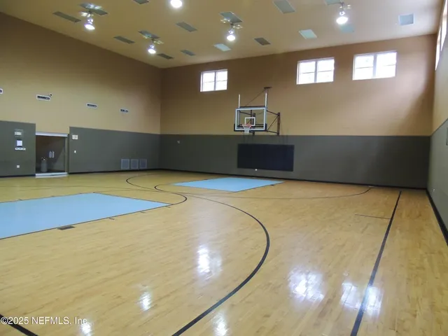 a view of a living room with kitchen