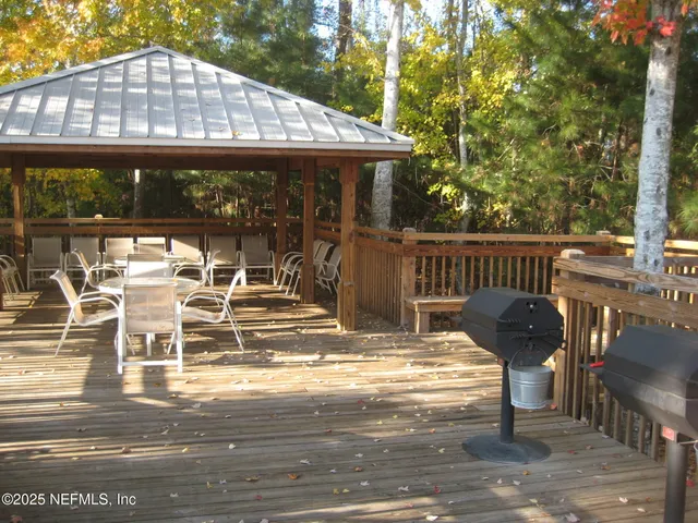a view of a chair and tables in the patio