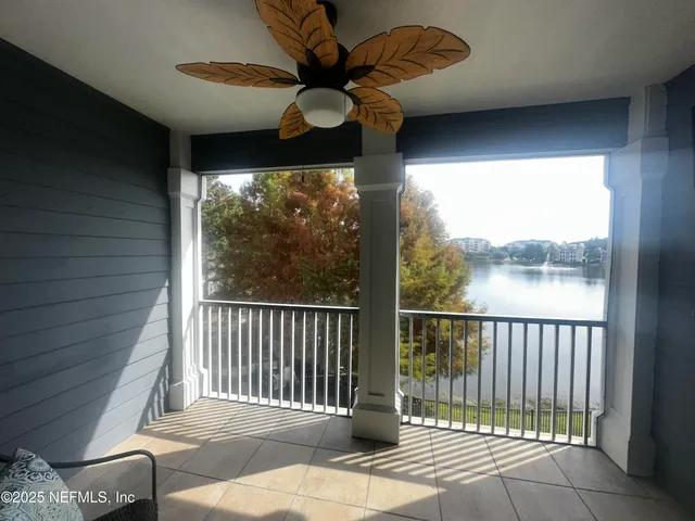 a balcony with a potted plant and outdoor space