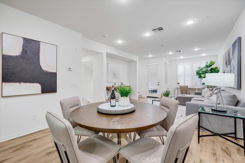 148 Capricorn Irvine, CA 92618 - Photo 13 of 66 a kitchen with a table and chairs