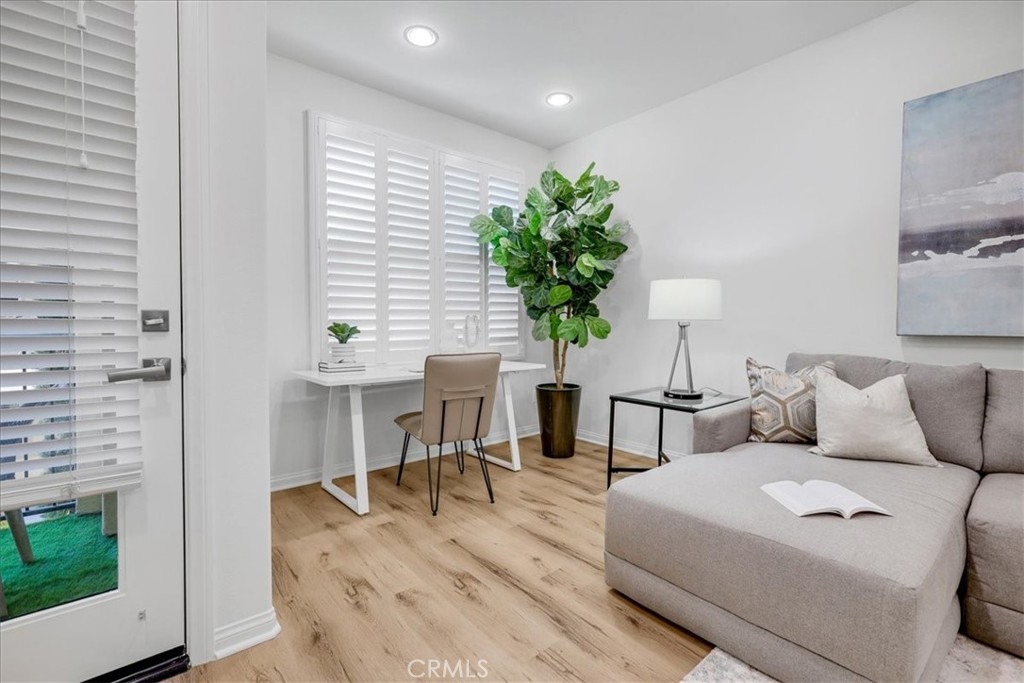 148 Capricorn Irvine, CA 92618 - Photo 30 of 66 a living room with furniture and a potted plant