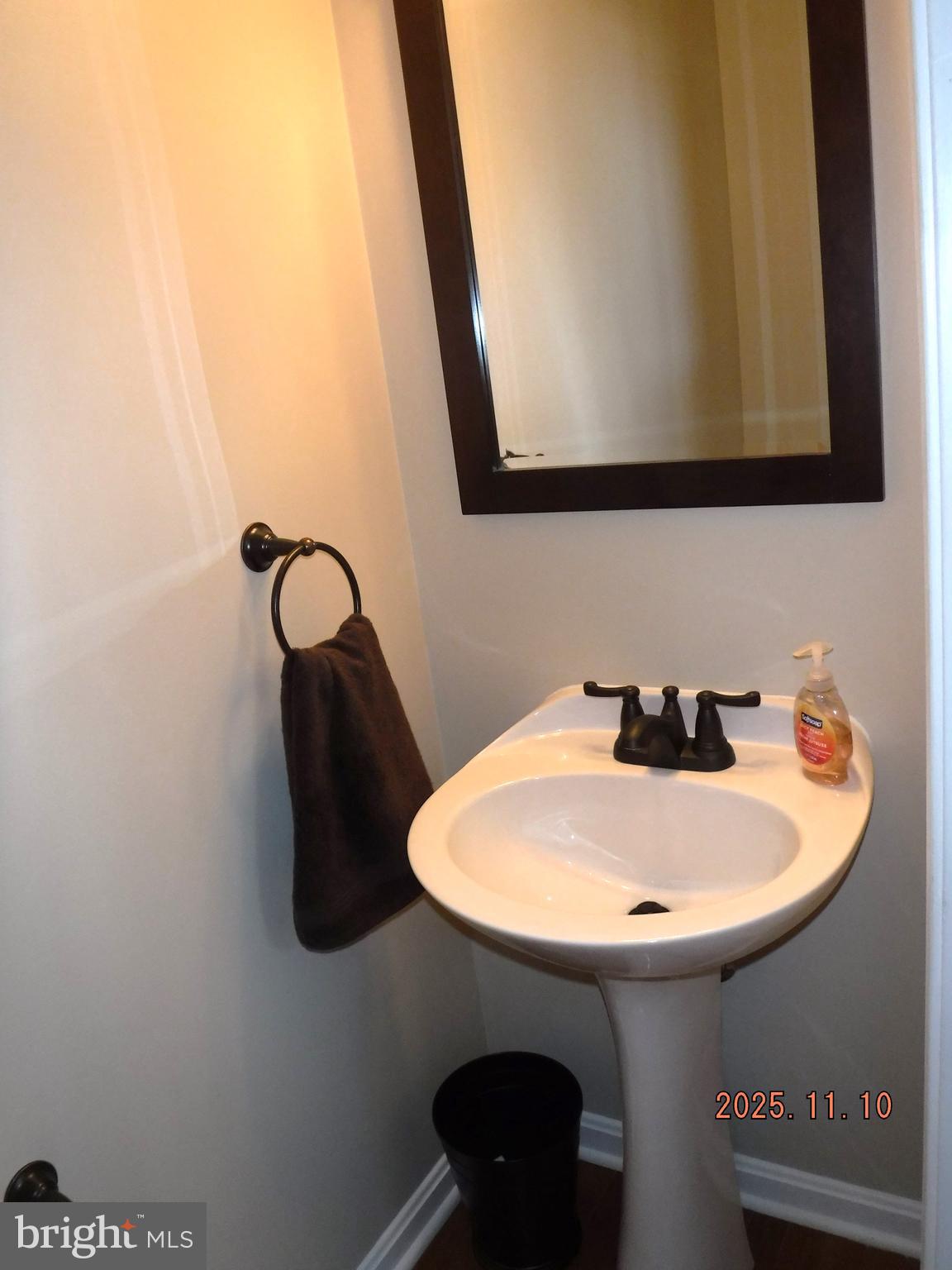 8918 Whitetail Court Perry Hall, MD 21128 - Photo 23 of 64 a bathroom with a sink and a mirror