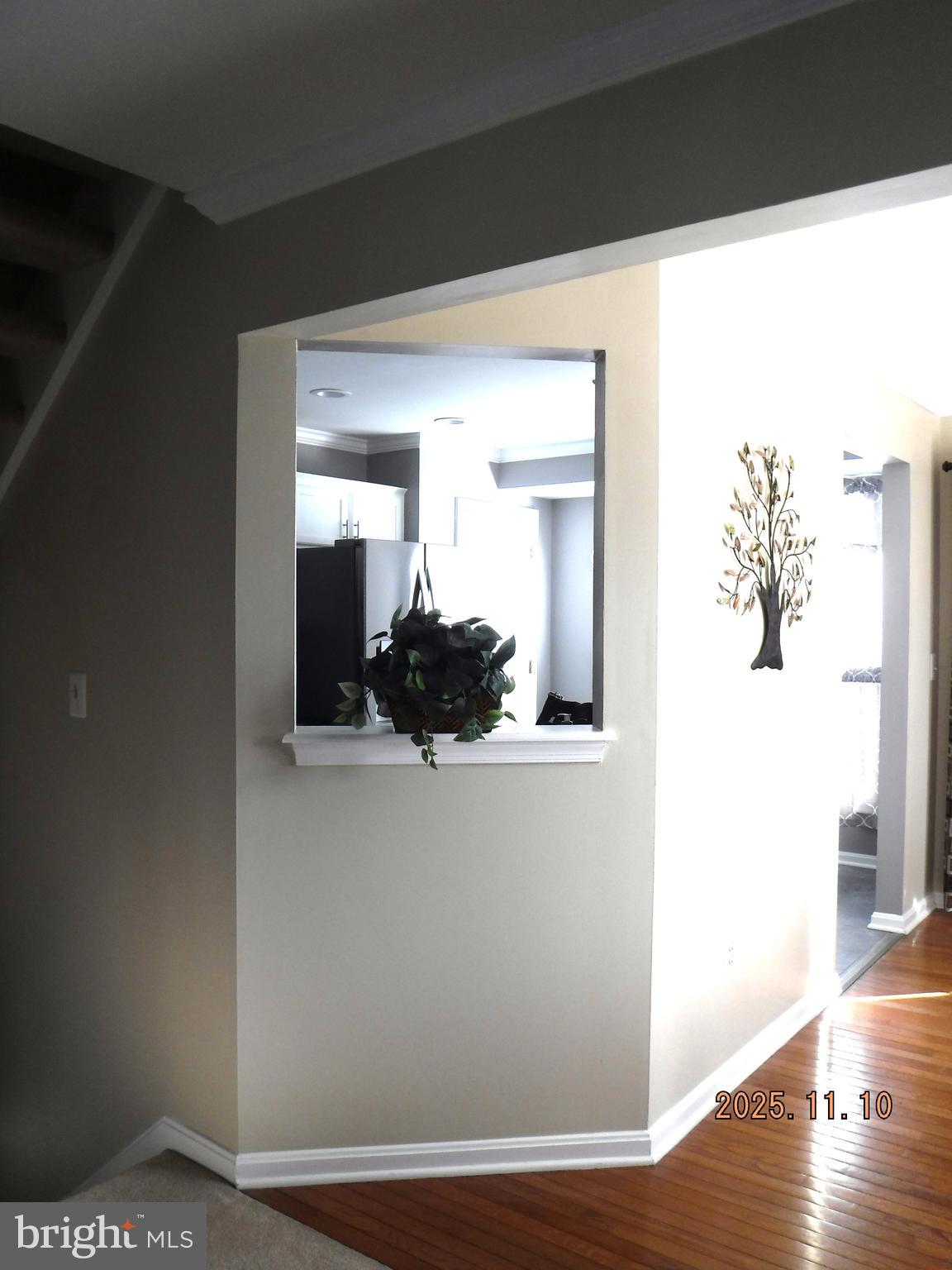 8918 Whitetail Court Perry Hall, MD 21128 - Photo 28 of 64 a view of a hallway with wooden floor and a living room