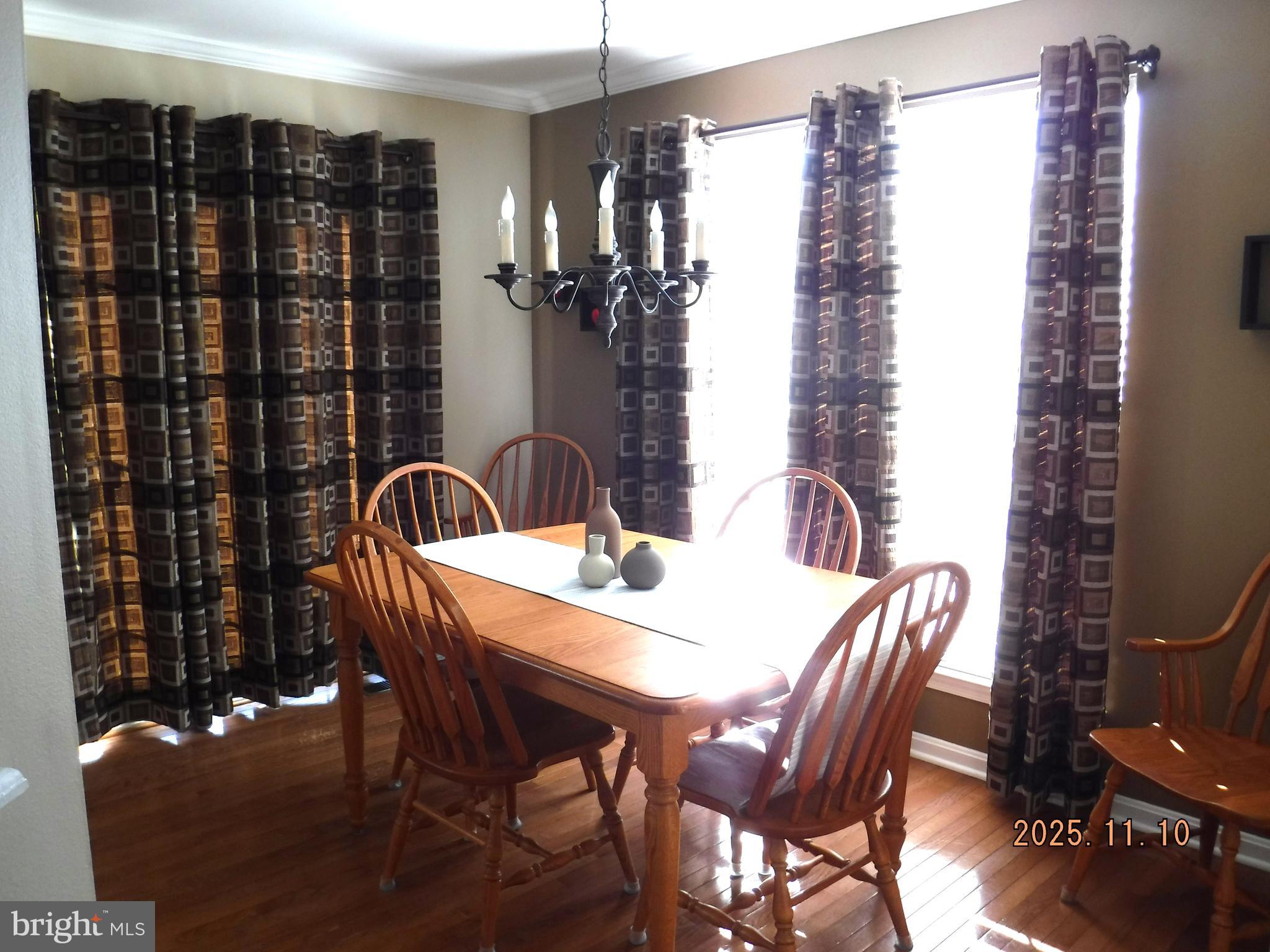 8918 Whitetail Court Perry Hall, MD 21128 - Photo 29 of 64 a view of a dining room with furniture and chandelier