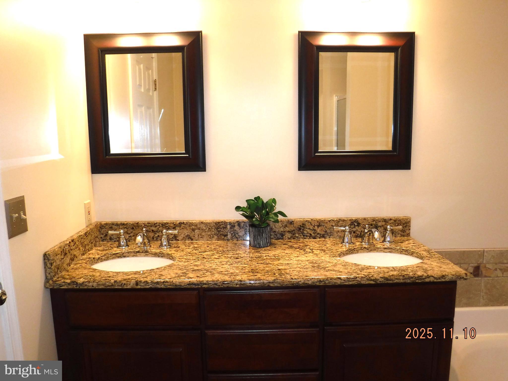 8918 Whitetail Court Perry Hall, MD 21128 - Photo 40 of 64 a bathroom with a sink and a mirror