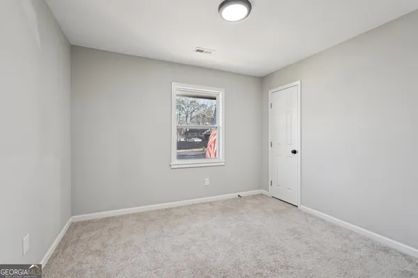an empty room with windows