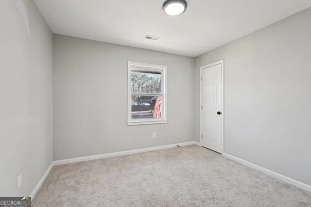 an empty room with windows