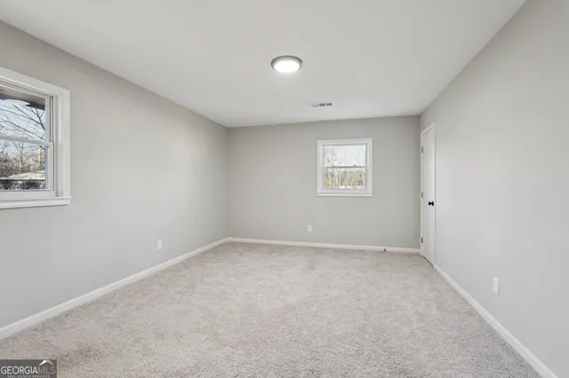 an empty room with windows