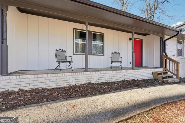 a front view of a house with a road