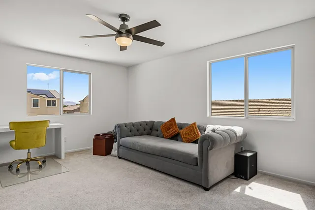 a bedroom with furniture and a window