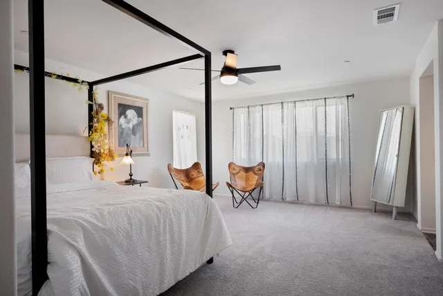 a bathroom with a tub sink double vanity and mirror