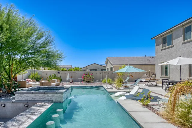 a view of a swimming pool with a patio