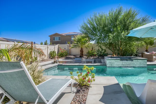 a view of a swimming pool with a patio