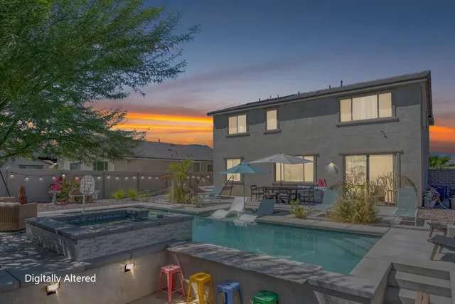 a view of a patio with dining table and chairs with a fireplace