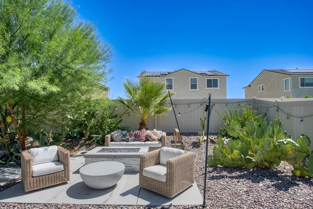 a view of a patio in the backyard