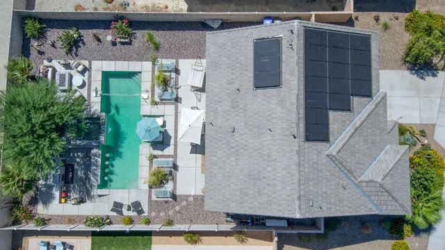 aerial view of a house with a garden and plants