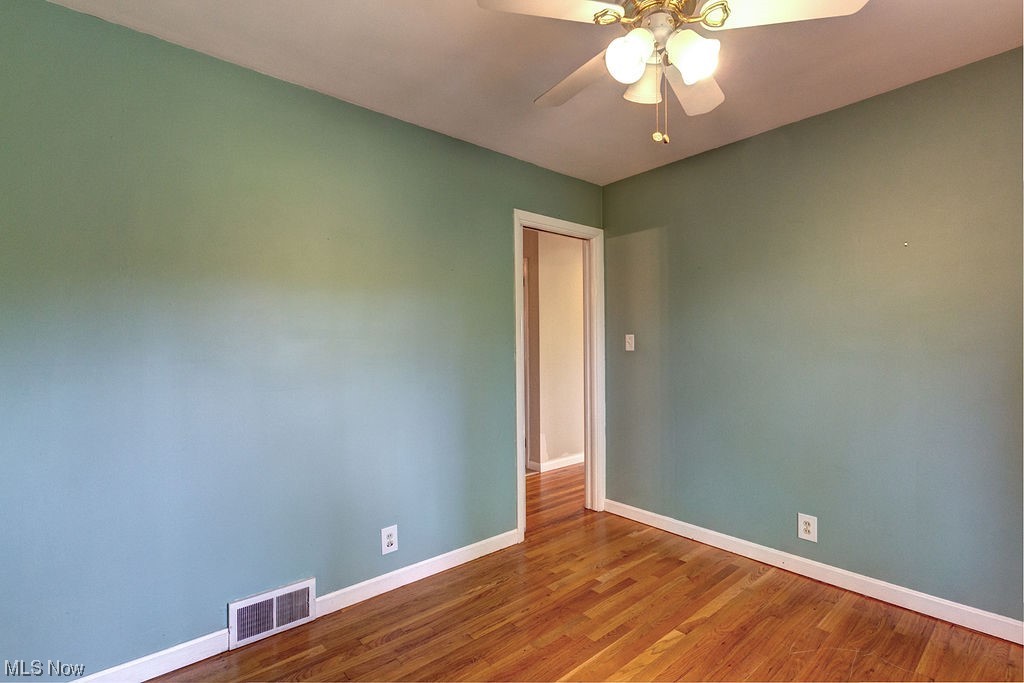 4897 South Sedgewick Road Cleveland, OH 44124 - Photo 17 of 31 This third bedroom features a ceiling fan and hardwood flooring