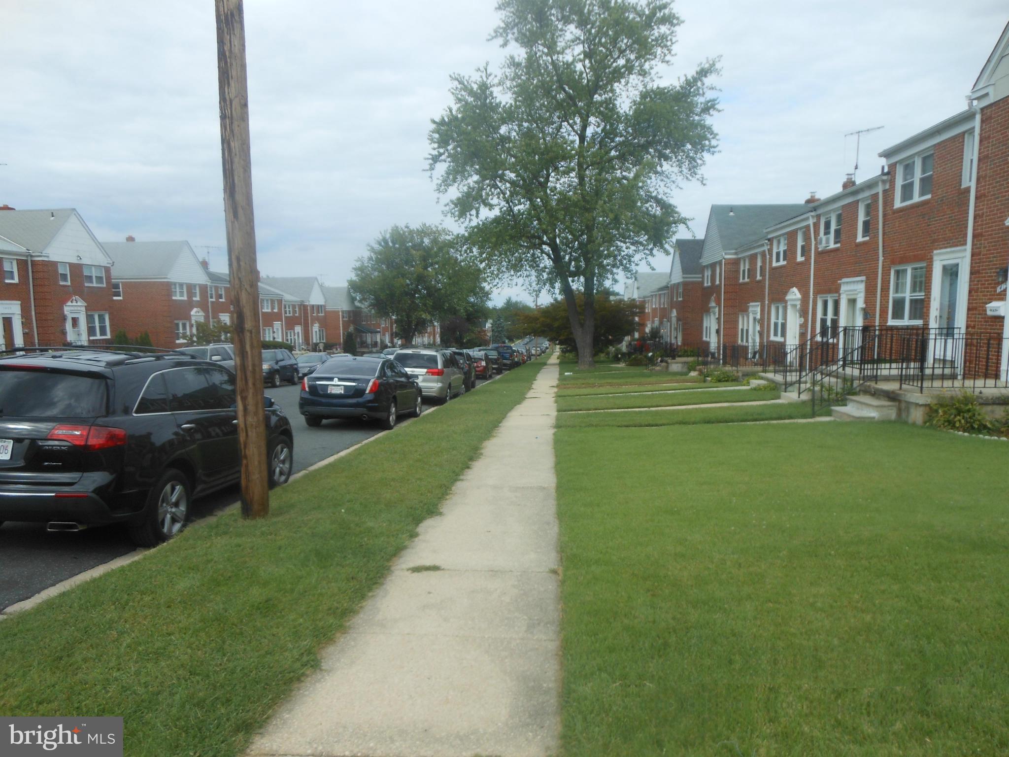 1413 Barrett Road Baltimore, MD 21207 - Photo 2 of 13 a view of a street with cars parked