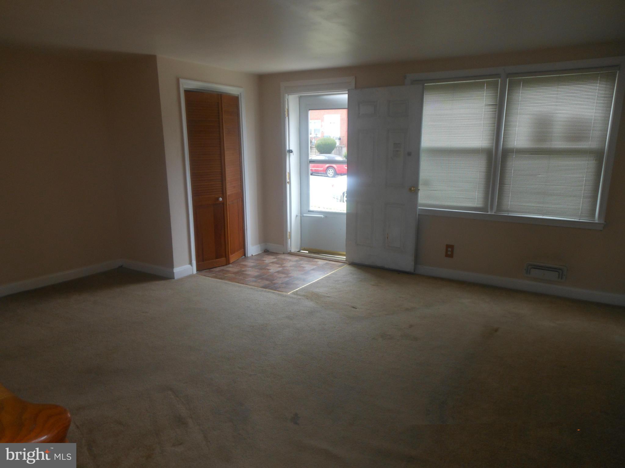 1413 Barrett Road Baltimore, MD 21207 - Photo 4 of 13 an empty room with windows