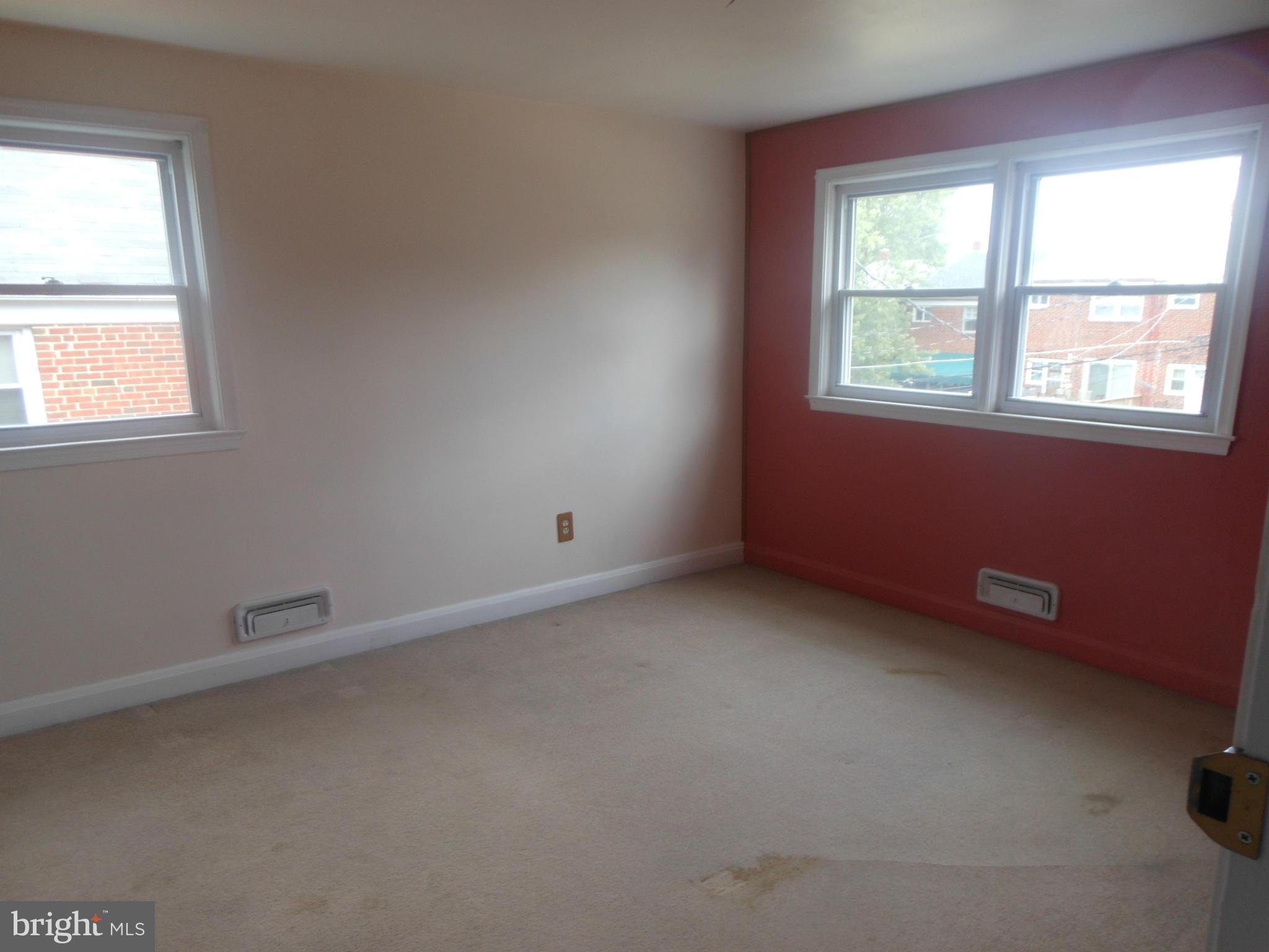 1413 Barrett Road Baltimore, MD 21207 - Photo 8 of 13 an empty room with a window