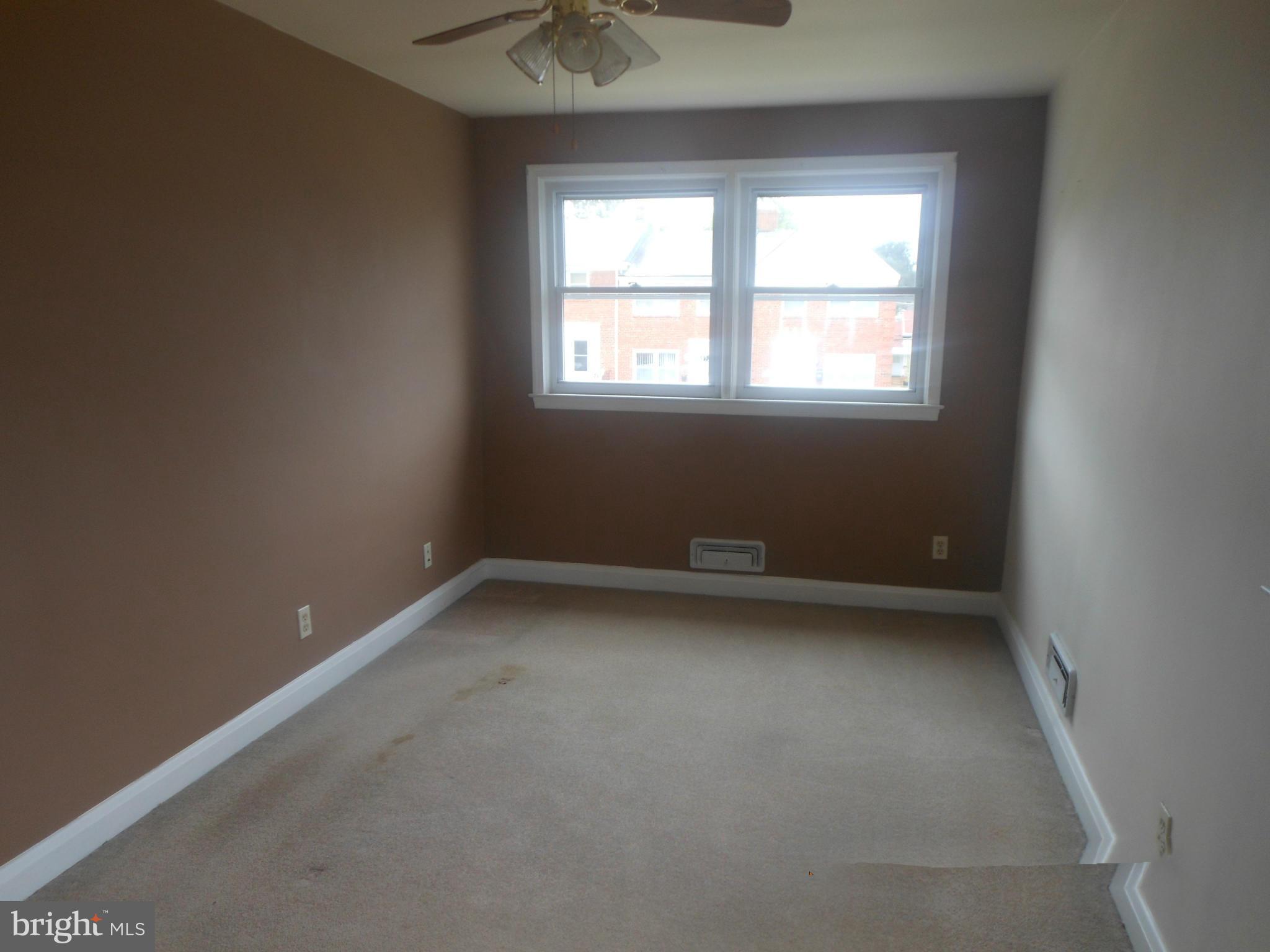 1413 Barrett Road Baltimore, MD 21207 - Photo 9 of 13 an empty room with a window