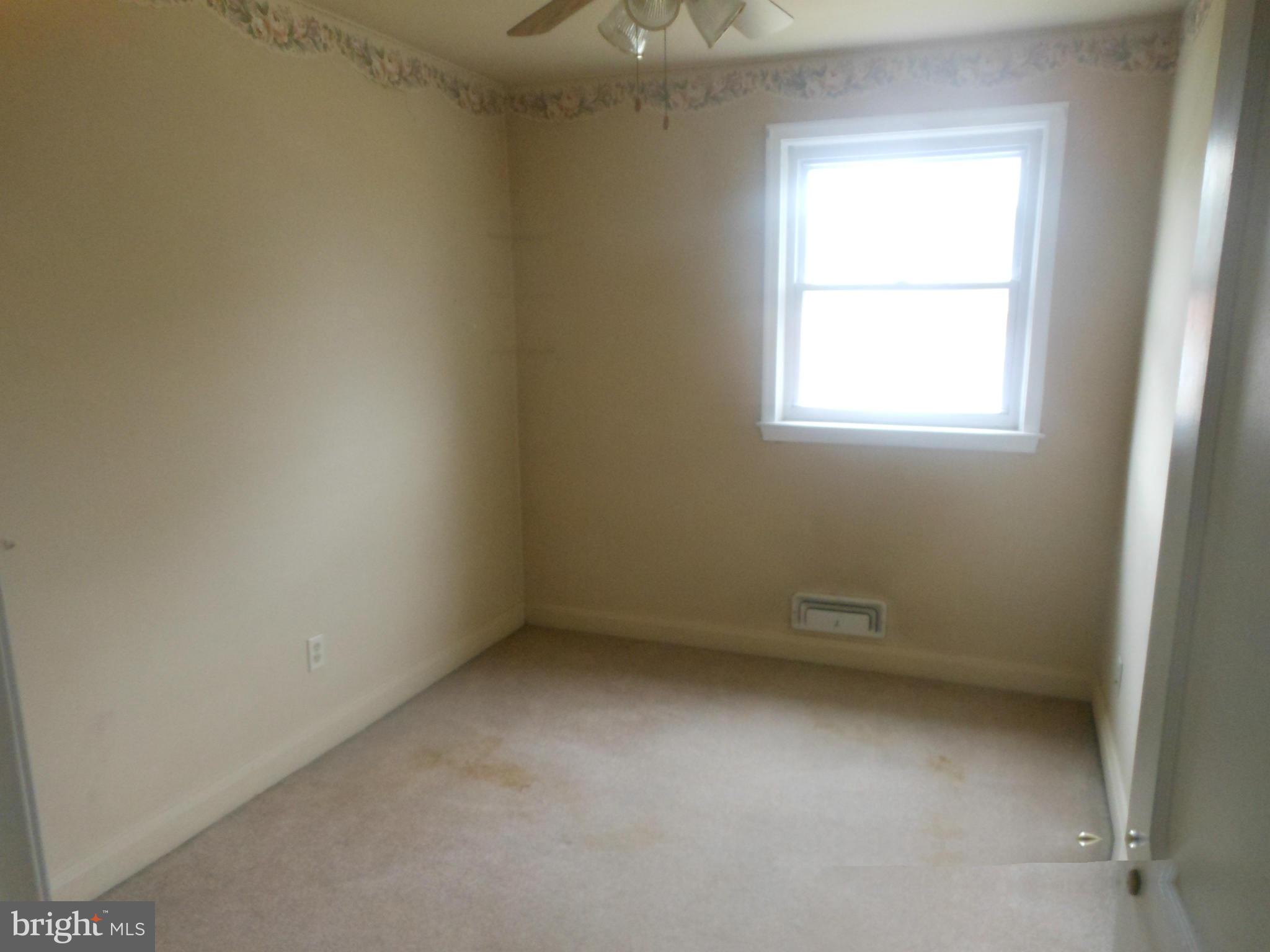 1413 Barrett Road Baltimore, MD 21207 - Photo 10 of 13 an empty room with a window