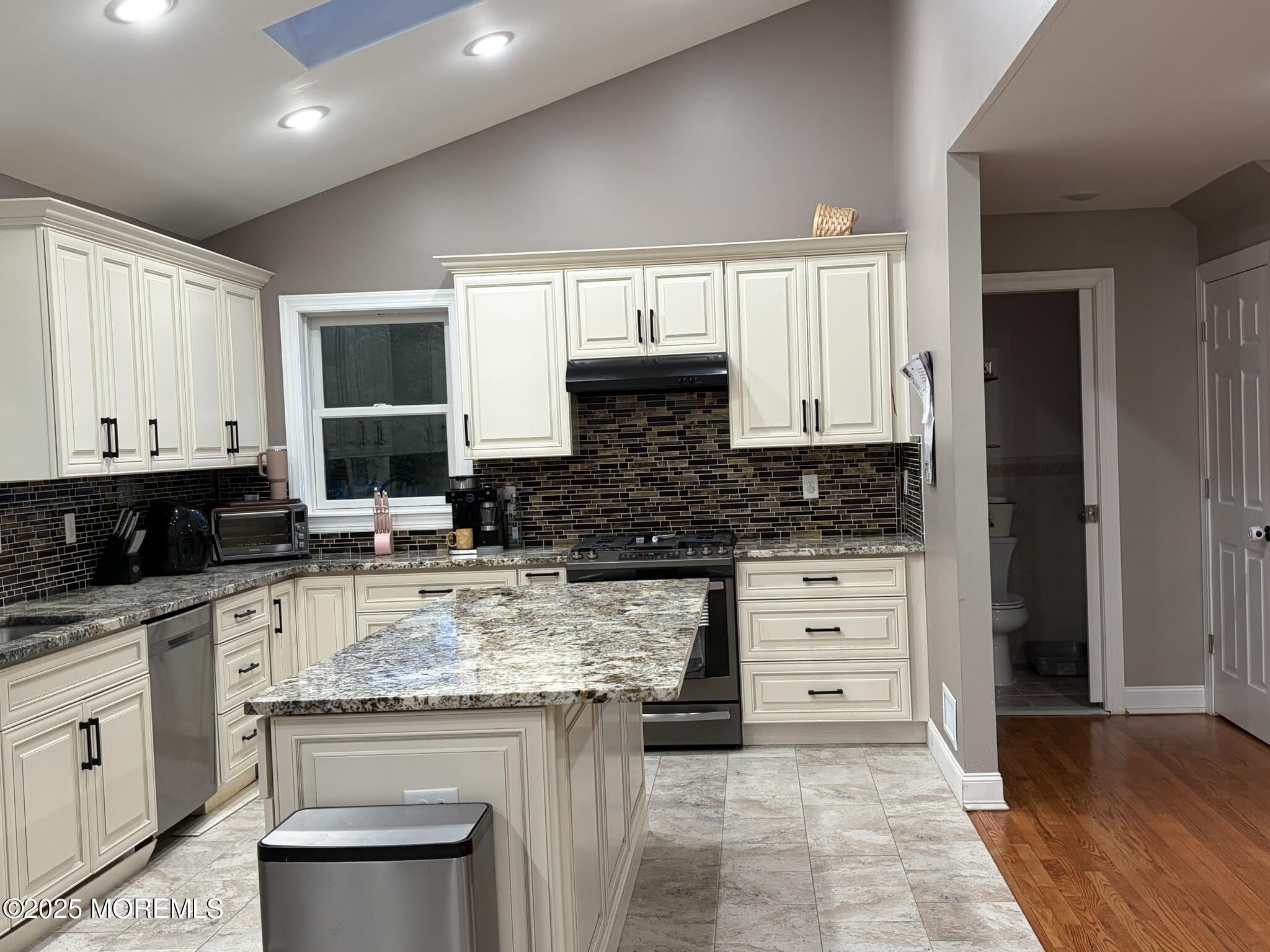 11 Chestnut Ridge Road Holmdel, NJ 07733 - Photo 11 of 44 a kitchen with a stove a sink and a refrigerator