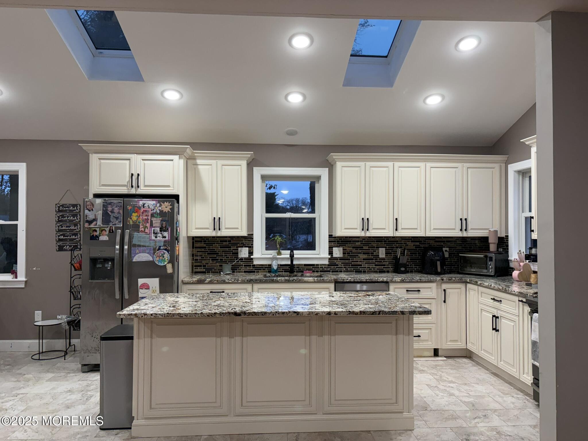 11 Chestnut Ridge Road Holmdel, NJ 07733 - Photo 12 of 44 a kitchen with stainless steel appliances granite countertop a sink and cabinets