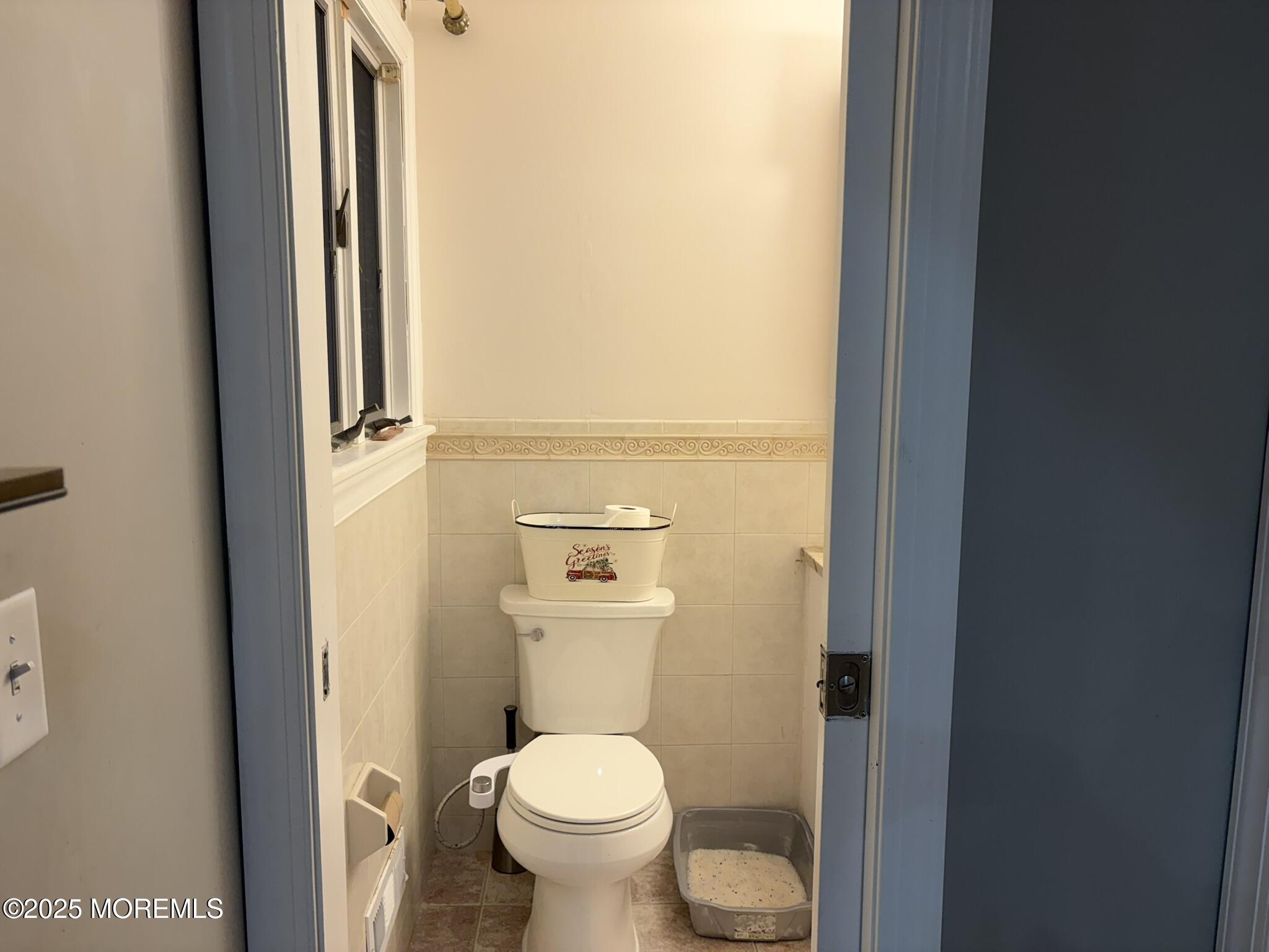 11 Chestnut Ridge Road Holmdel, NJ 07733 - Photo 15 of 44 a bathroom with a granite countertop toilet and a sink