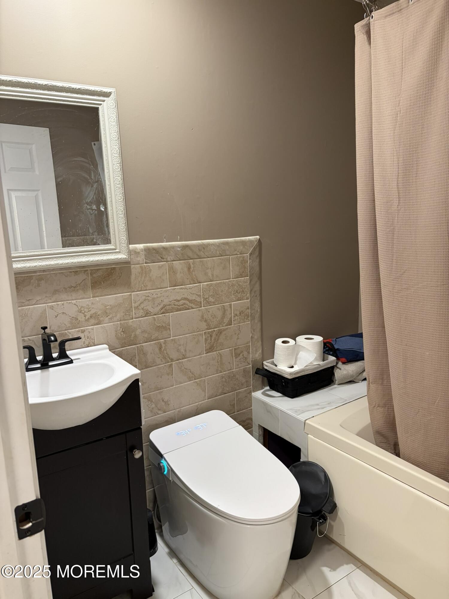 11 Chestnut Ridge Road Holmdel, NJ 07733 - Photo 18 of 44 a bathroom with a sink and a toilet