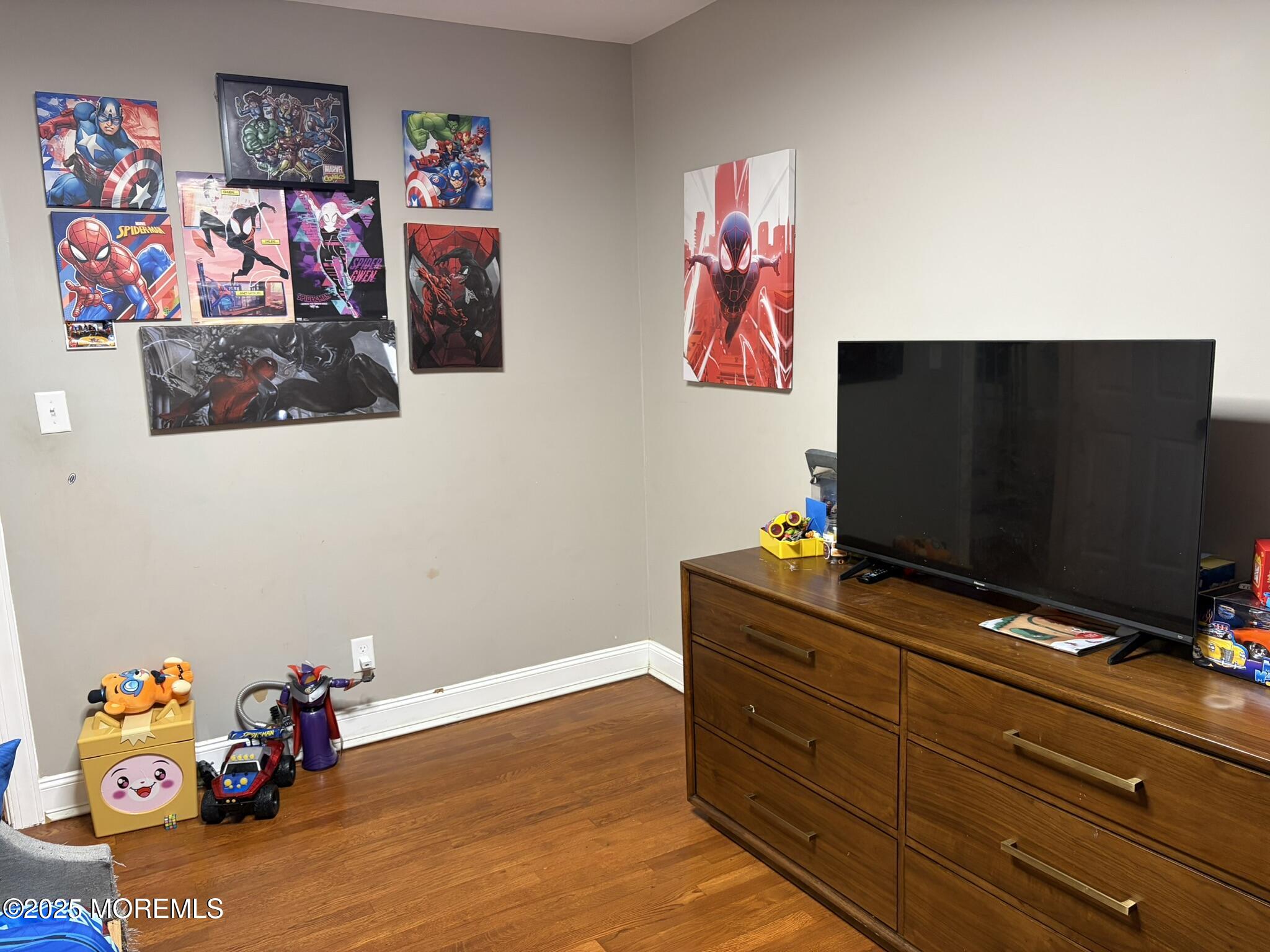 11 Chestnut Ridge Road Holmdel, NJ 07733 - Photo 21 of 44 a room with toys and flat screen tv