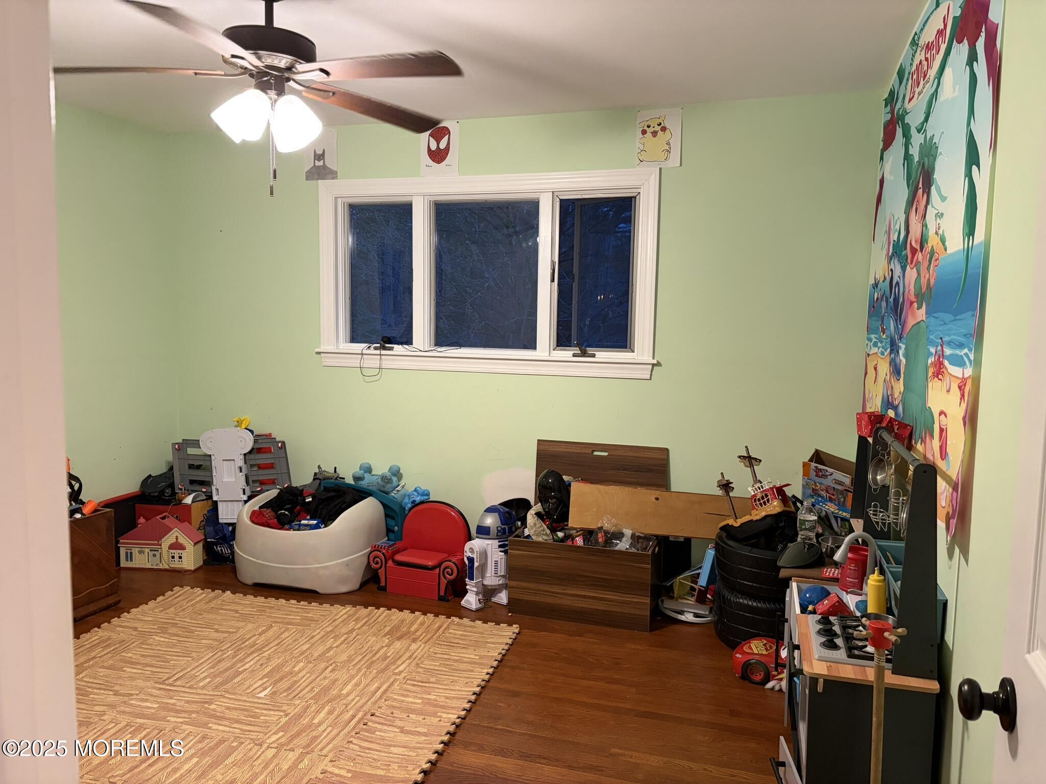 11 Chestnut Ridge Road Holmdel, NJ 07733 - Photo 22 of 44 a bedroom with furniture and a chandelier