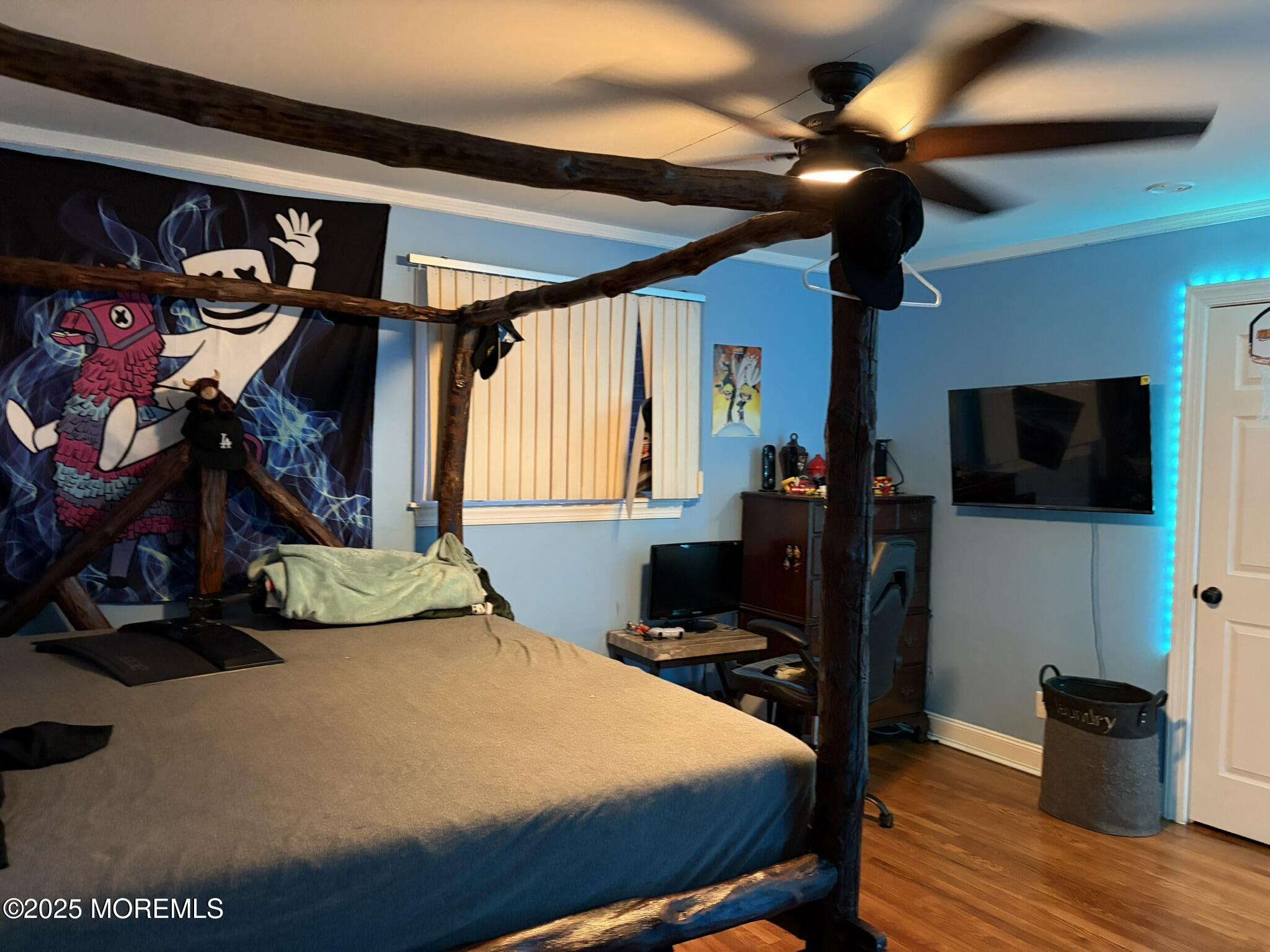 11 Chestnut Ridge Road Holmdel, NJ 07733 - Photo 25 of 44 a bedroom with a bed and a flat tv screen on dresser