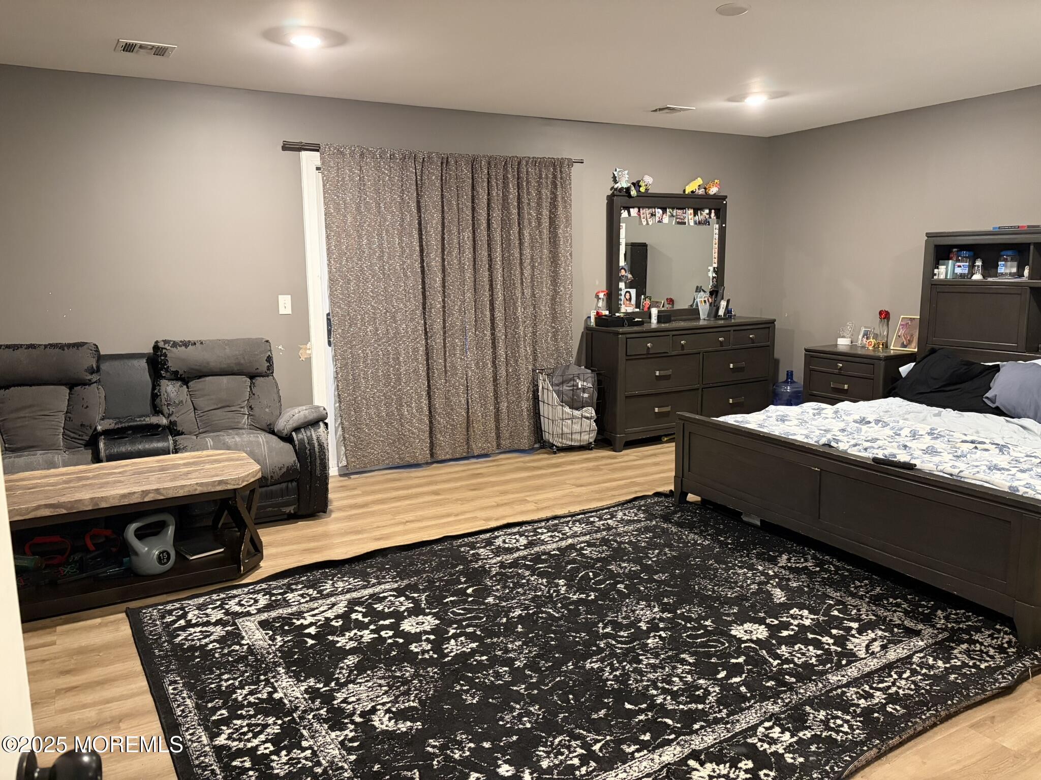 11 Chestnut Ridge Road Holmdel, NJ 07733 - Photo 33 of 44 a living room with a couch and a wooden floor
