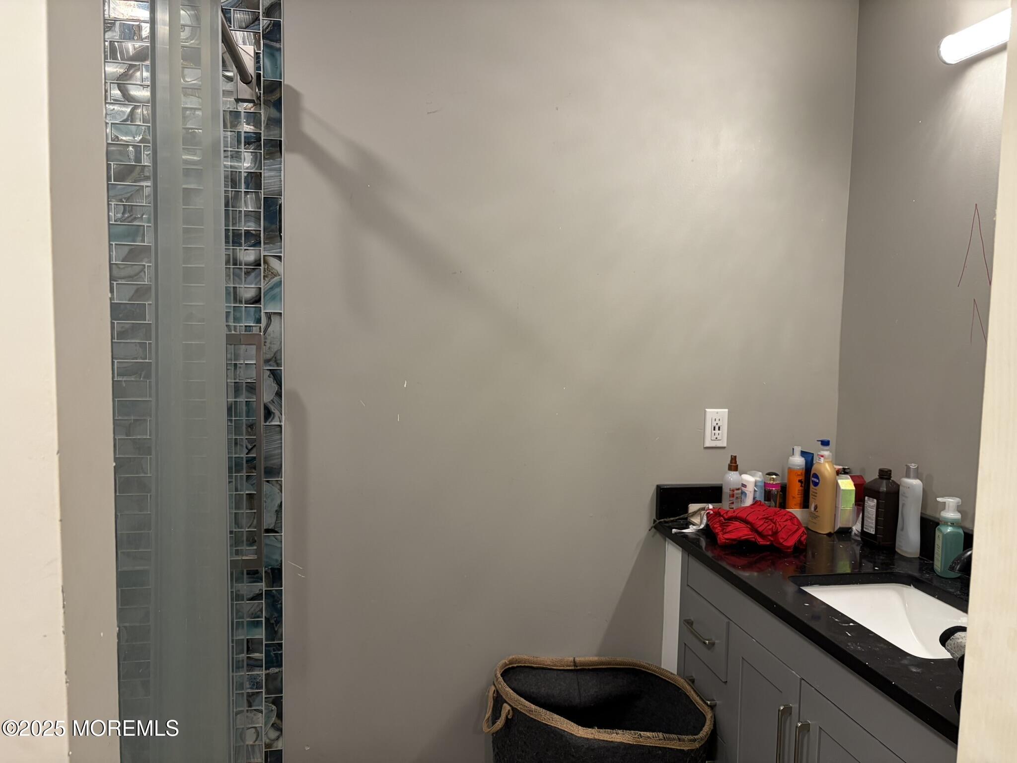 11 Chestnut Ridge Road Holmdel, NJ 07733 - Photo 35 of 44 a room with a sink and cabinets